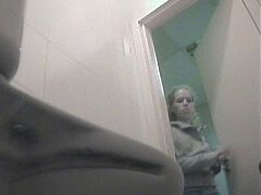 Sexy blonde caught in the toilet