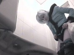 Sexy blonde in the toilet